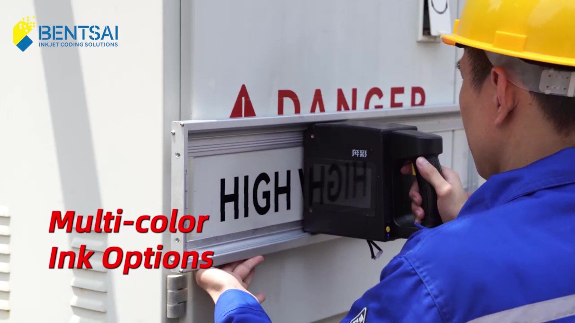 Worker using a large character inkjet printer