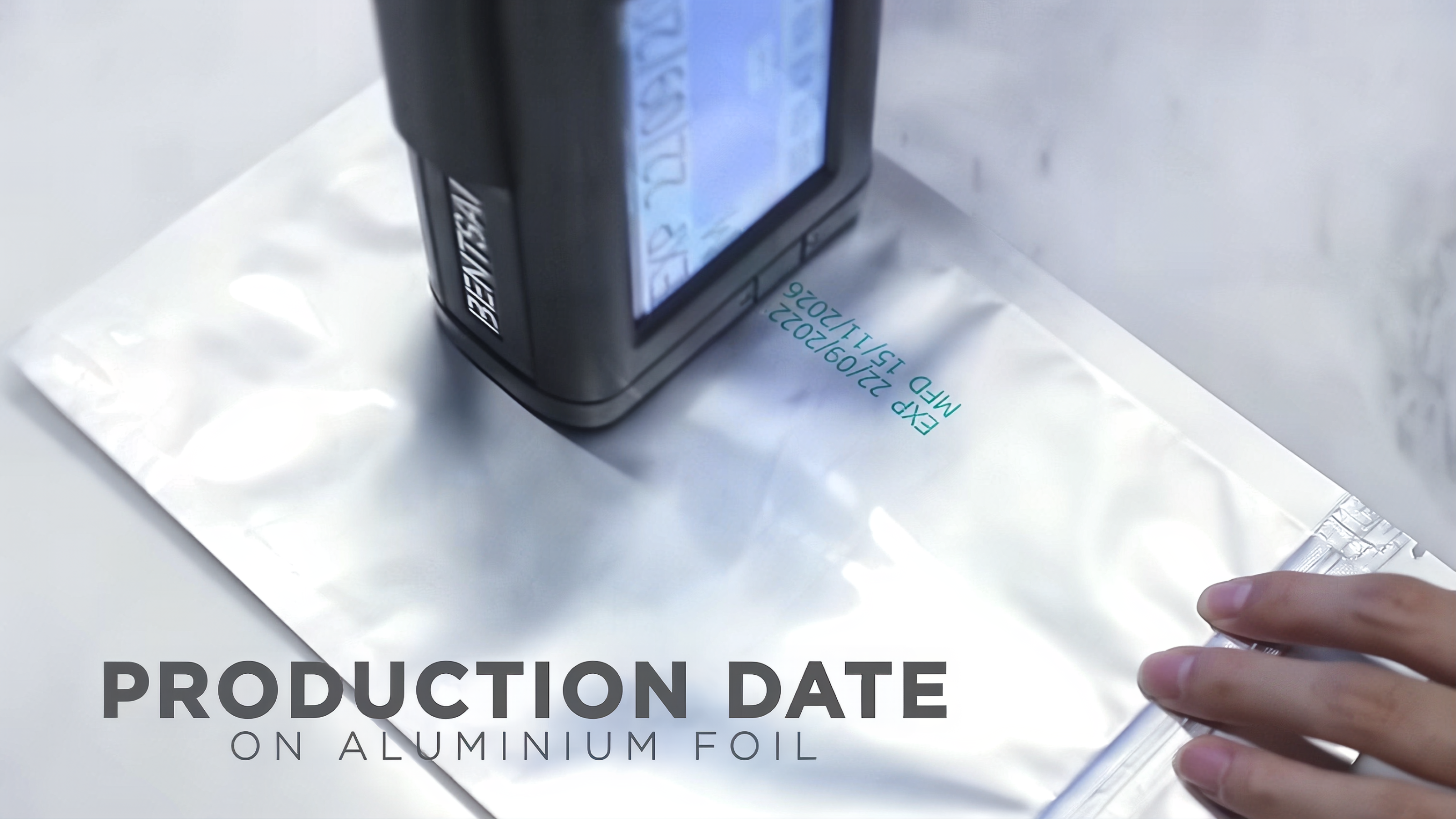 Industrial-inkjet-coder-printing-a-clear-expiration-date-and-batch-code-on-a-food-package